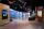 A museum gallery featuring artwork projected onto large screens and colourful geometric shapes.
